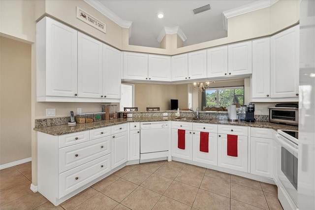 kitchen featuring white cabinets, ornamental molding, sink, dishwasher, and range