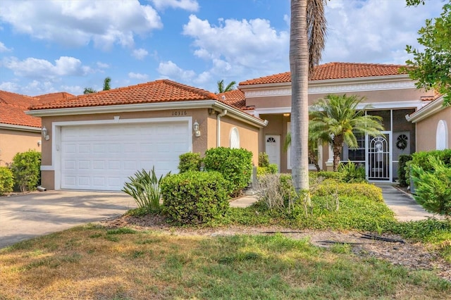 mediterranean / spanish-style house featuring a garage