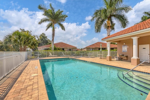 view of swimming pool with a patio area