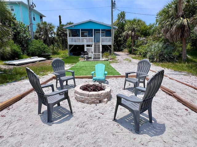 view of yard with an outdoor fire pit