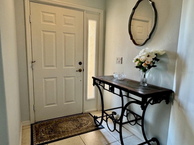 foyer entrance featuring tile floors