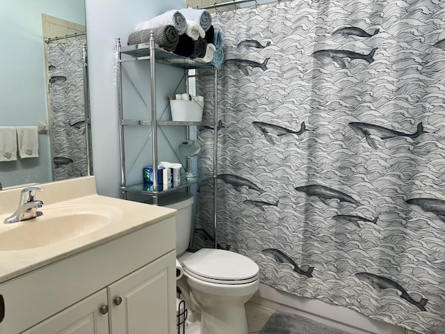 bathroom featuring toilet and vanity