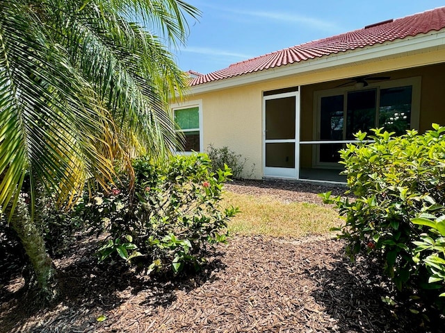 view of yard with ceiling fan