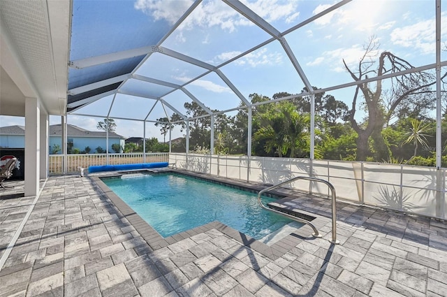 view of pool featuring a patio area and a lanai