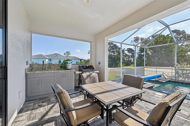 sunroom / solarium featuring sink and a pool