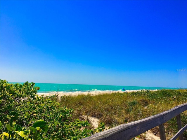 property view of water featuring a beach view