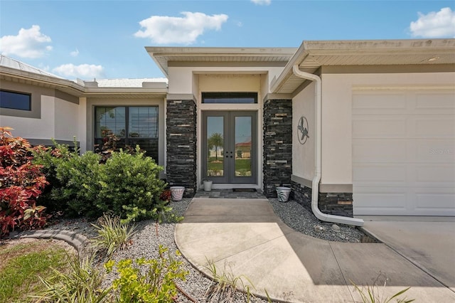 property entrance featuring french doors and a garage