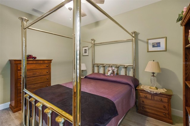 bedroom featuring ceiling fan and hardwood / wood-style floors