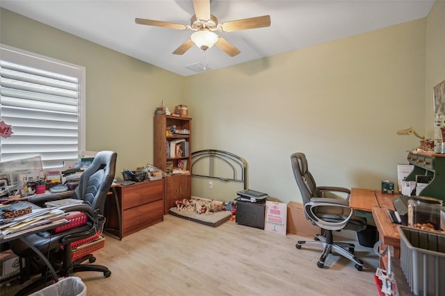 office space featuring light wood-type flooring and ceiling fan