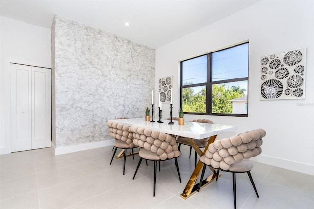 dining space featuring light tile patterned floors, recessed lighting, and baseboards