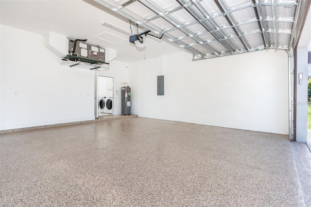 garage with a garage door opener, electric panel, washer and clothes dryer, and electric water heater