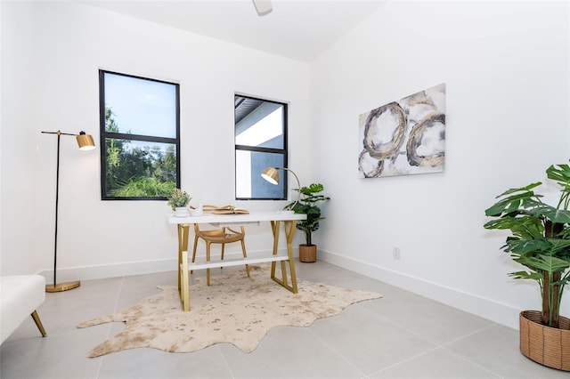 office space featuring light tile patterned floors and baseboards