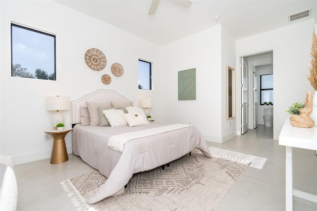 bedroom featuring a ceiling fan, connected bathroom, visible vents, and baseboards