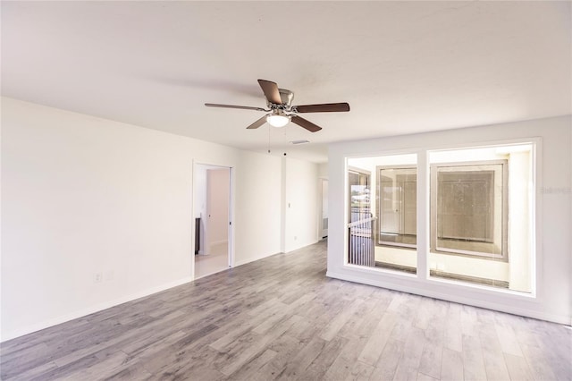 unfurnished room with ceiling fan and light hardwood / wood-style floors