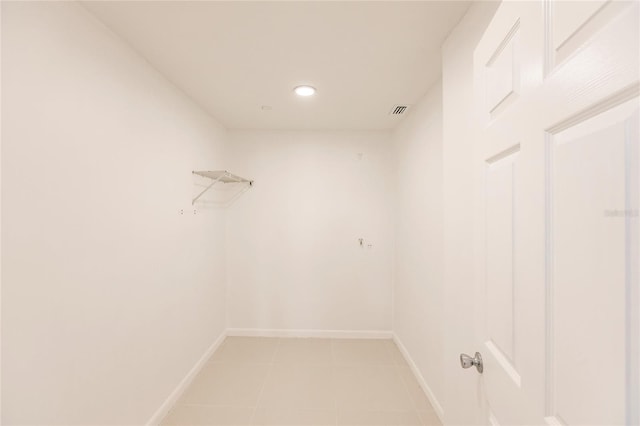 spacious closet featuring light tile patterned flooring