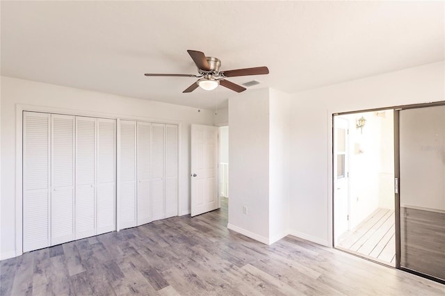 unfurnished bedroom featuring ceiling fan and light hardwood / wood-style flooring