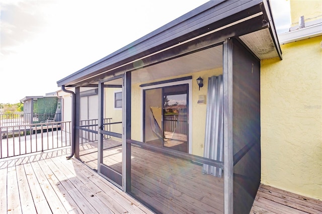 wooden terrace with a sunroom