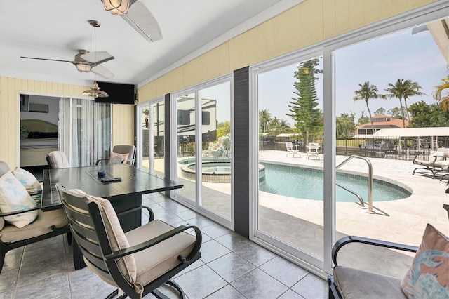 sunroom with ceiling fan