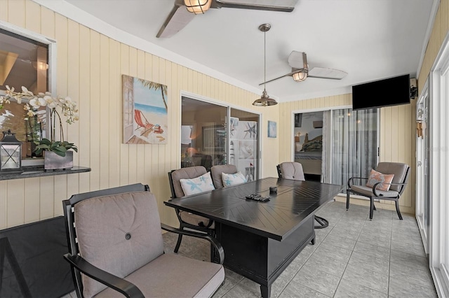 interior space with tile flooring and ceiling fan