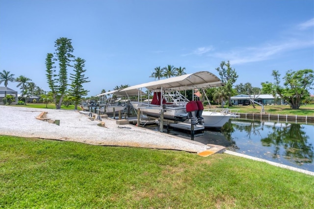 dock area featuring a water view and a yard