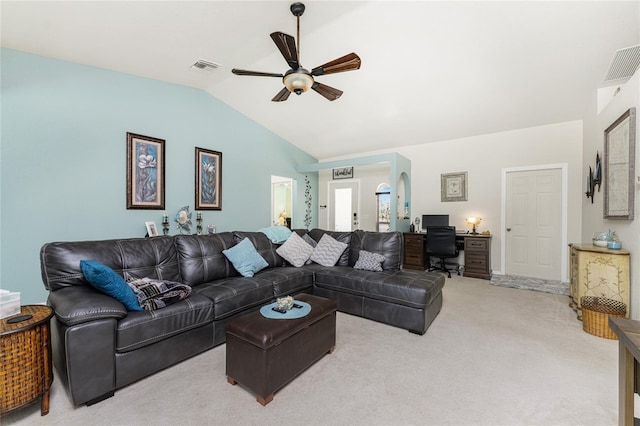 living room featuring ceiling fan, carpet floors, and lofted ceiling