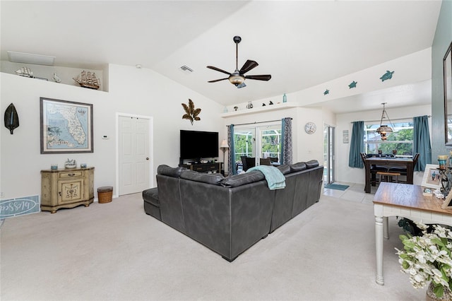 living room with light carpet, french doors, ceiling fan, and vaulted ceiling