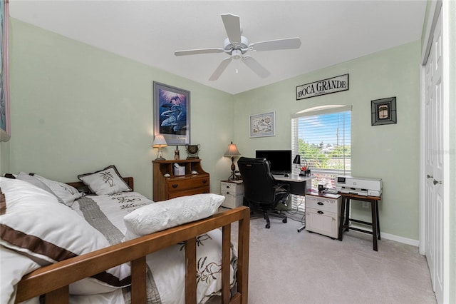 bedroom with light carpet and ceiling fan