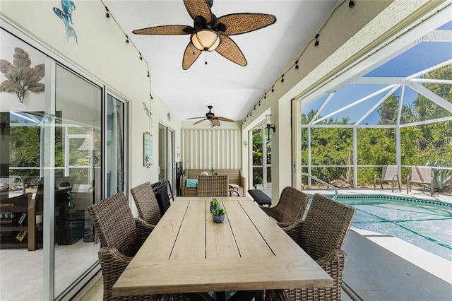 sunroom with lofted ceiling and ceiling fan