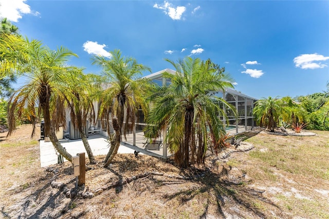 view of yard with a lanai