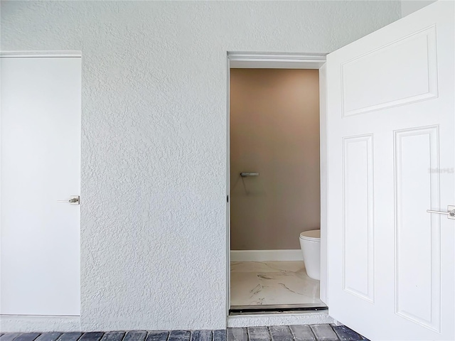 bathroom featuring toilet