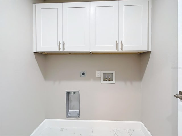 laundry area with hookup for a washing machine, cabinets, and hookup for an electric dryer