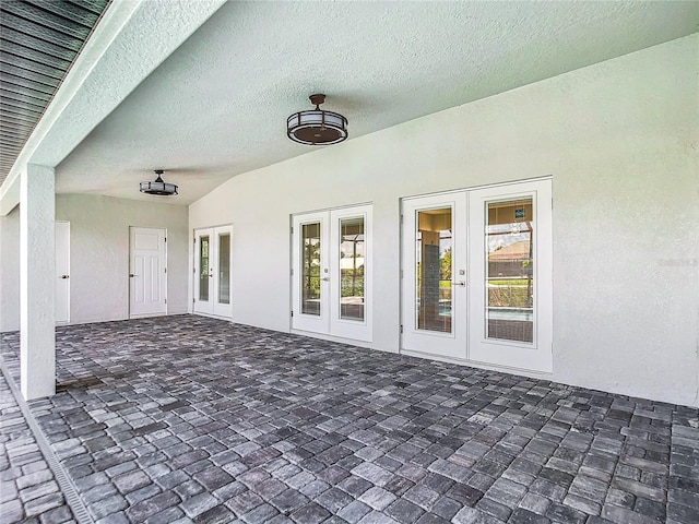 view of patio with ceiling fan and french doors