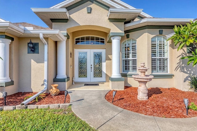 entrance to property featuring french doors