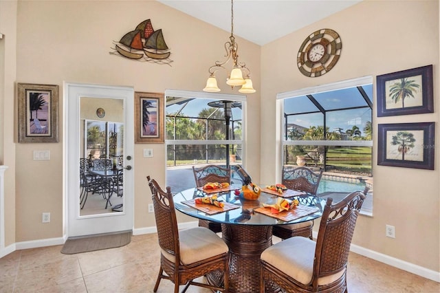 tiled dining room with a notable chandelier