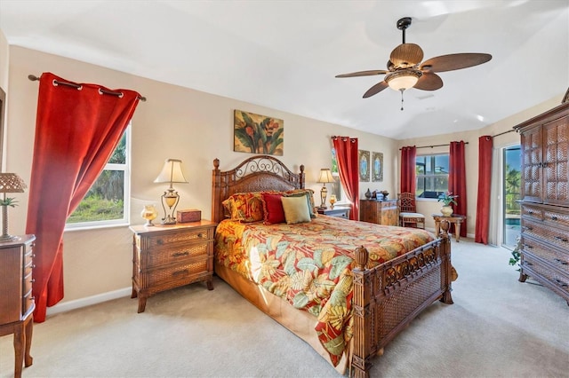 bedroom with access to exterior, light carpet, and ceiling fan