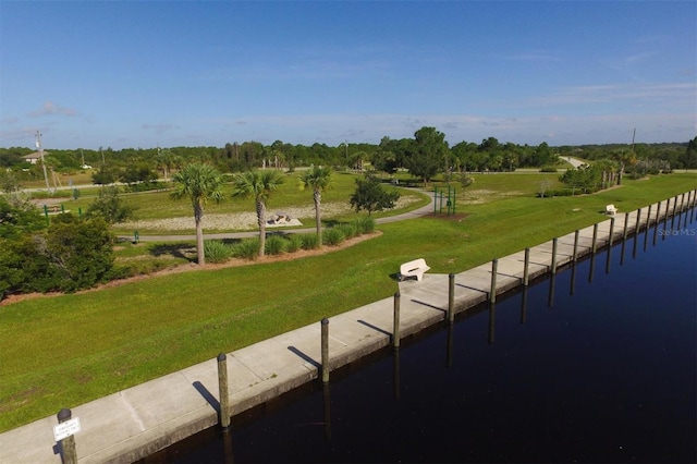 view of home's community featuring a yard and a water view