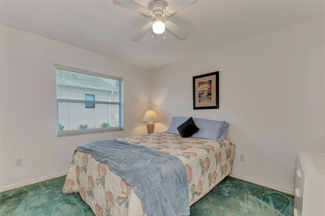 bedroom with dark colored carpet and ceiling fan