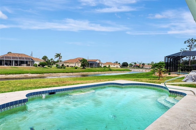 view of swimming pool with a lawn and glass enclosure