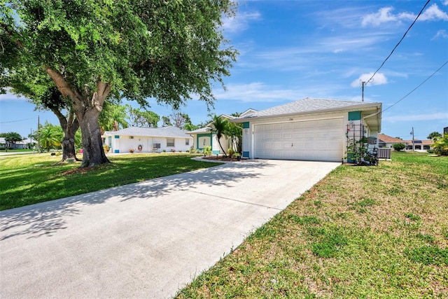 ranch-style house featuring a garage and a front yard