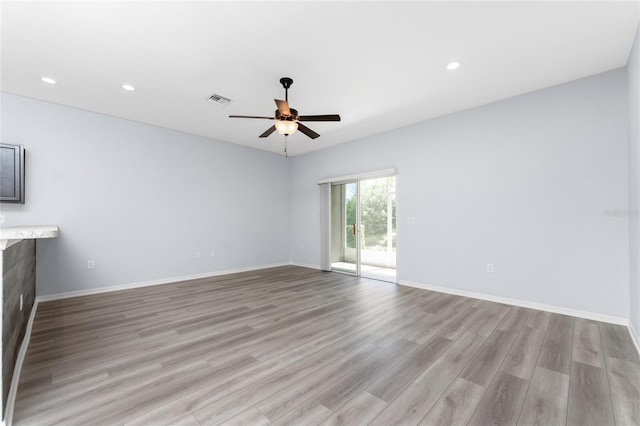 unfurnished living room with light hardwood / wood-style floors and ceiling fan