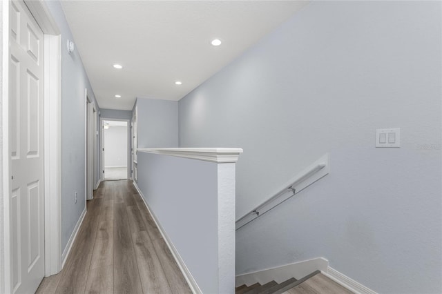 hallway with wood-type flooring