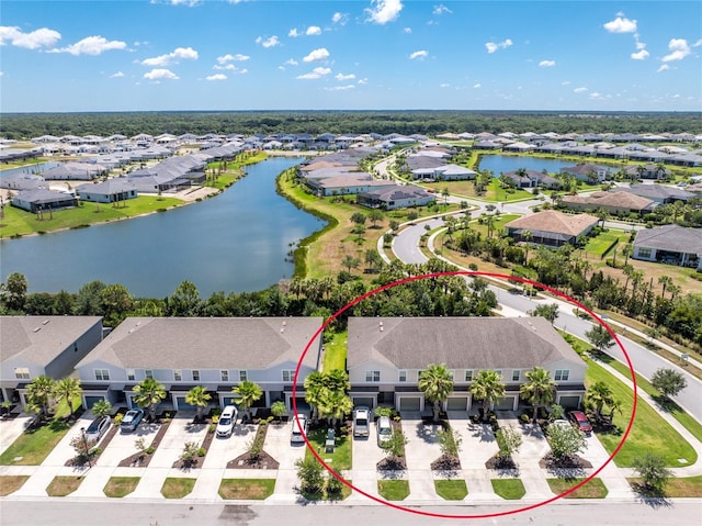 birds eye view of property with a water view