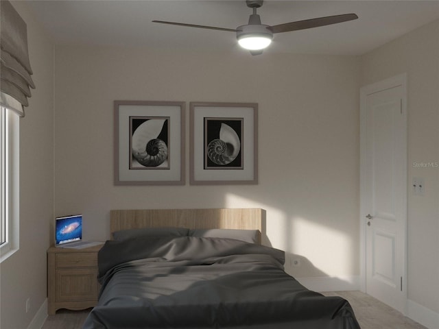 bedroom featuring ceiling fan and baseboards