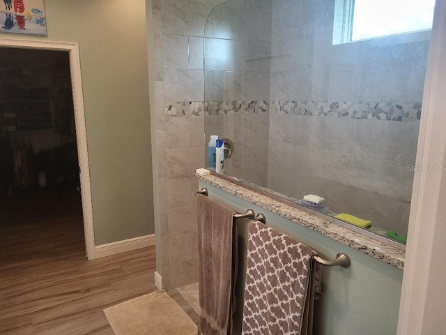 bathroom with vanity and hardwood / wood-style flooring