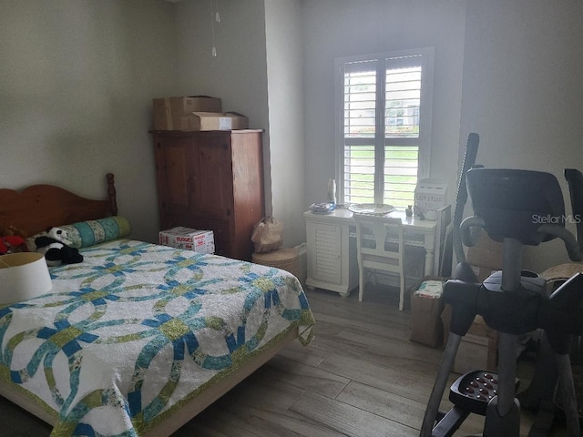 bedroom with wood-type flooring