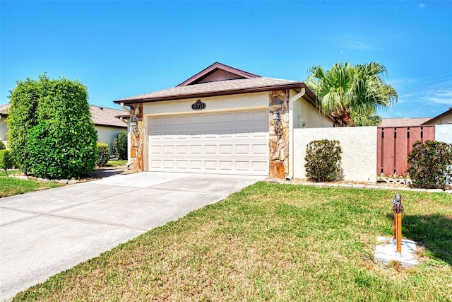 single story home featuring a garage and a front lawn