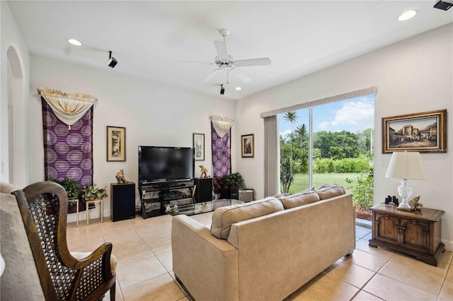 tiled living room featuring ceiling fan