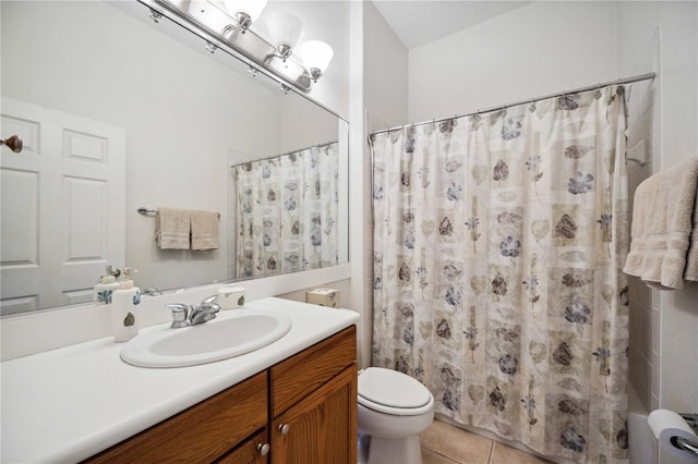 bathroom with toilet, vanity, tile patterned floors, and curtained shower