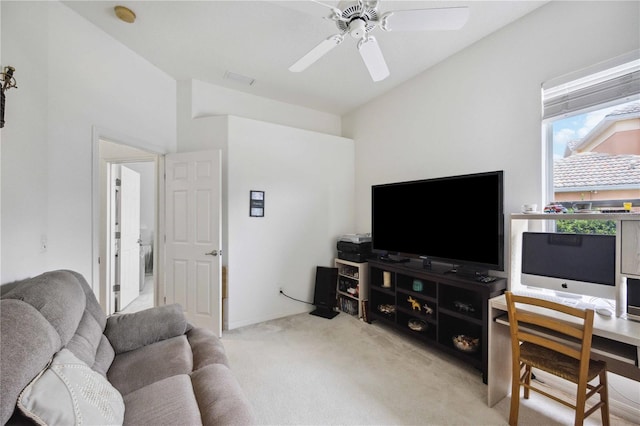 carpeted living room with ceiling fan