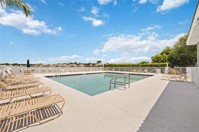 view of swimming pool with a patio